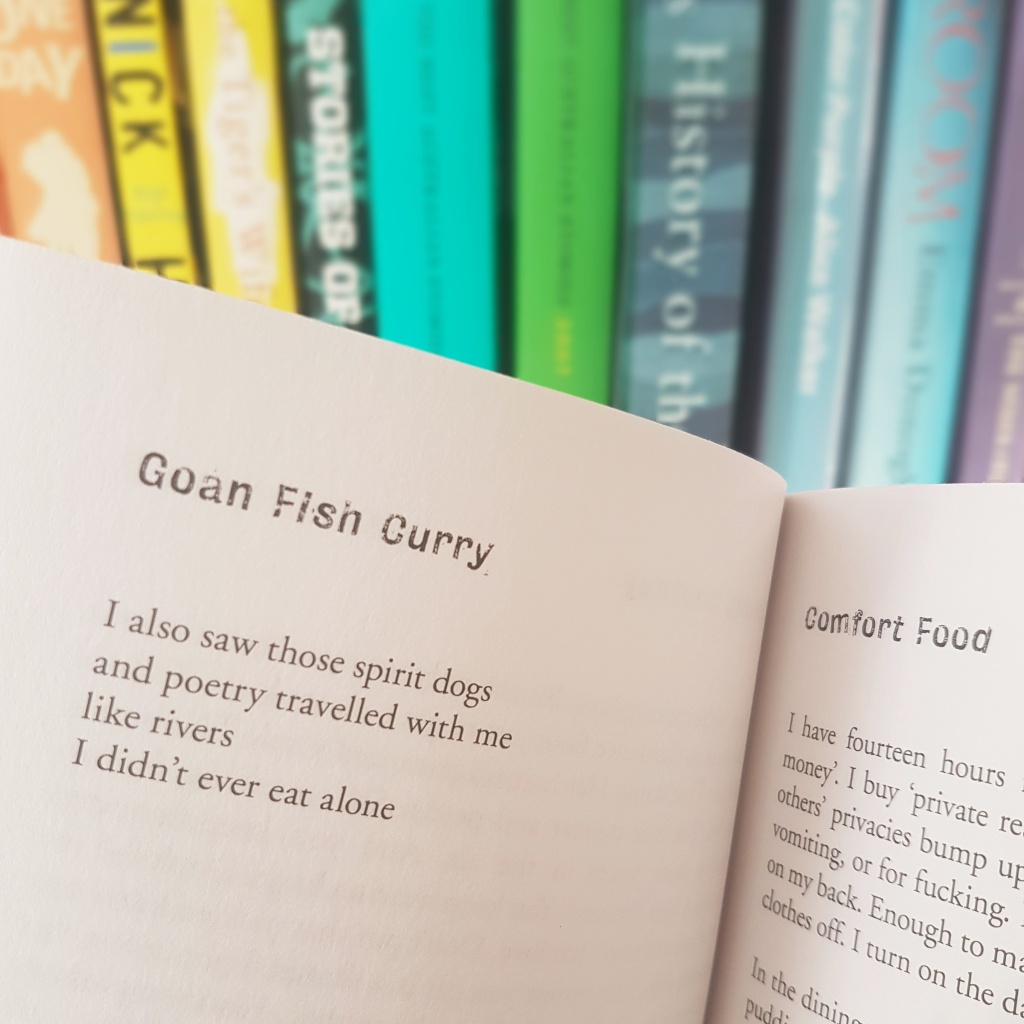 Poetry from Comfort Food against a colourful bookshelf